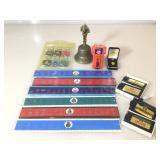 Lot of rulers and keychains depicting the ranking