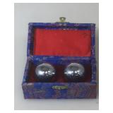 Asian meditation balls with their box.