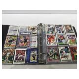 Album of sports cards with graded favre rookie