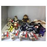 assortment of shirts, videos, goods, stuffed