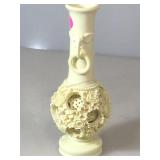 Carved Plastic Puzzle Vase With elephants.