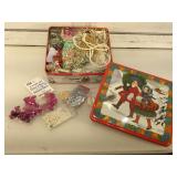Tin of beading supplies.