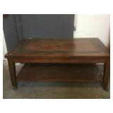 Wooden coffee table on wheels, approx 30x50x20