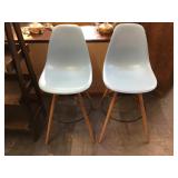 Pair of orange plastic barstools