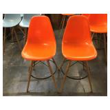Pair of orange plastic barstools