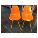Pair of orange plastic barstools
