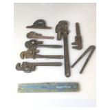 Bin of pipe wrenches , levels, etc