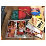 Lot of adult books and signed Hooters calendar