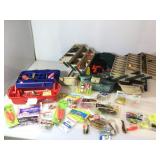 Two tackle boxes with assorted fishing gear.