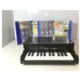 Two Binders of Pokemon Cards and a Tabletop piano