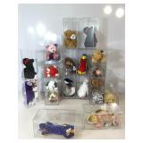 Assorted Beanie Babies with display cases.