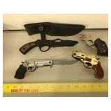 4 knives in handgun form , largest does not fold,