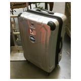 Large hard luggage bag on wheels