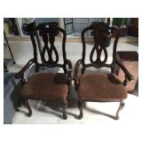 Pair of wooden carved captain chairs