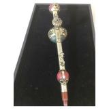 Intricately detailed opium pipe. 12in L