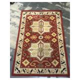 Red 80% wool machine made rug, approx 60x92