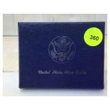 1983 Unc. Olympic Silver Dollar in box with info