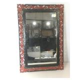 Mirror with red and black, carved look