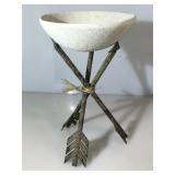 Metal Arrow sculpture and clay bowl.