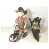Cowboy kid doll on tricycle w/wooden statue,