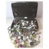 Vintage luggage bag full of watches and more