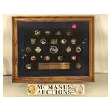 Group of 20 NASA pins , framed , 15.5 x 12.25