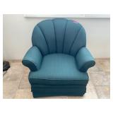 Green Padded Arm Chair. Swivels and on Rollers