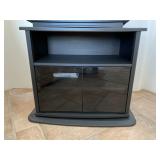 Black Swivel TV Stand with Frosted Glass Doors.