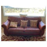 Leather Sofa with 4 decorative pillows. 88in.