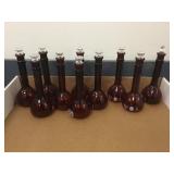 GROUP OF RED GLASS FLASKS GROUP OF RED GLASS FLASKS