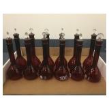GROUP OF RED GLASS FLASKS GROUP OF RED GLASS FLASKS