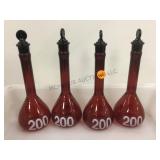 GROUP OF RED GLASS FLASKS GROUP OF RED GLASS FLASKS