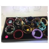 TRAY LOT OF POLISHED STONE BRACELETS