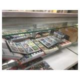 SHELF LOT OF SPORTS CARDS
