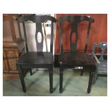 PAIR OF BLACK WOODEN CHAIRS.