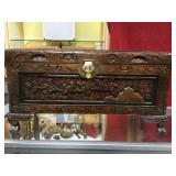 ORNATE CARVED CLAW FOOT CHEST WITH BRASS