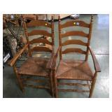 A PAIR OF WOODEN CHAIRS WITH RATTAN SEATS