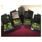 4 GREEN GLASS PAPERWEIGHTS IN CASES