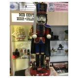 TALL WOODEN NUTCRACKER, SMALL NUTCRACKER AT BASE