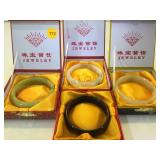 4 JADE BANGLE BRACELETS WITH BOXES 4 JADE BANGLE BRACELETS WITH BOXES