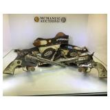 A PAIR OF TOY 'COWBOY PISTOLS & LEATHER HOLSTER A PAIR OF TOY 'COWBOY PISTOLS & LEATHER HOLSTER