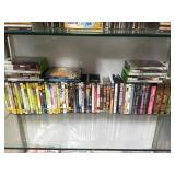 SHELF LOT OF DVD'S, 'WARCRAFT'. XBOX GAMES & MORE SHELF LOT OF DVD'S, 'WARCRAFT'. XBOX GAMES & MORE