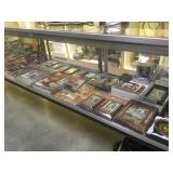 SHELF LOT OF SPORTS MEMORABILIA, TRADING CARDS