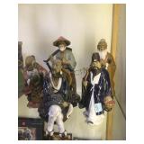 COLLECTION OF MUD-MEN ASIAN FIGURES