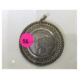 1922-S SILVER PEACE DOLLAR WITH BEZEL