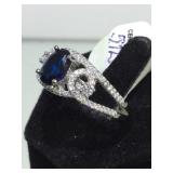 STERLING RING W/ CLEAR & DARK BLUE GEMSTONES,