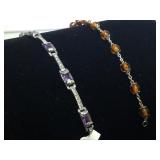 PAIR OF STERLING BRACELETS W/ ORANGE  PURPLE STONE