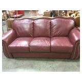 RED LEATHER HOBNAIL ACCENTED 3 CUSHION SOFA