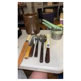 Brown crock no name, potato masher, knives  and