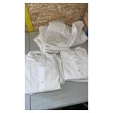 8 white lab coats different sizes. Like new